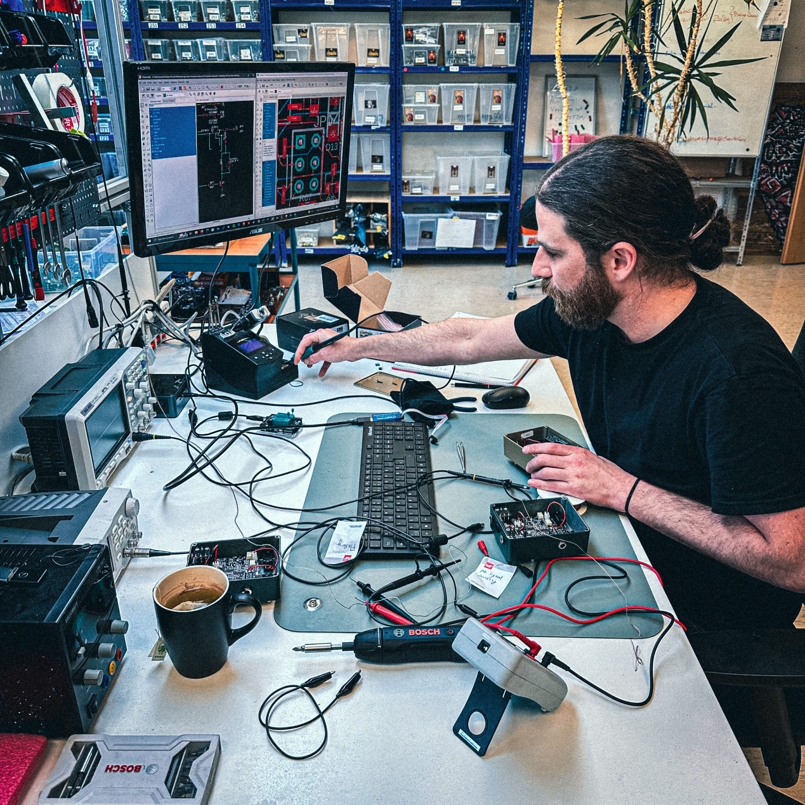 Picture of Chris testing and developing new pedals, at the KMA factory in Berlin, 2023